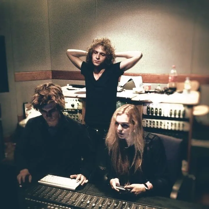The band Portland in the control room during a session
