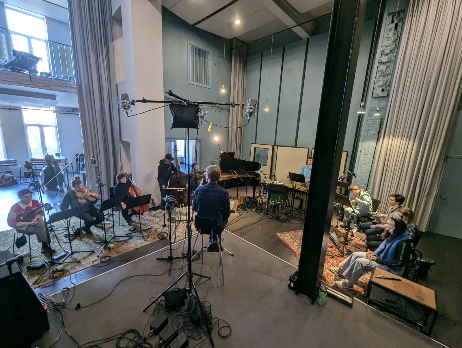 An ensemble recording session in a large studio room
